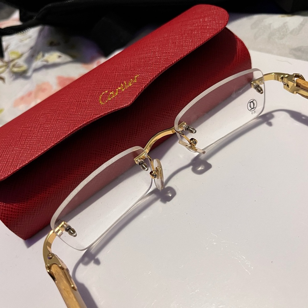 Cartier Women's Glasses with Gold Accents and Red Case